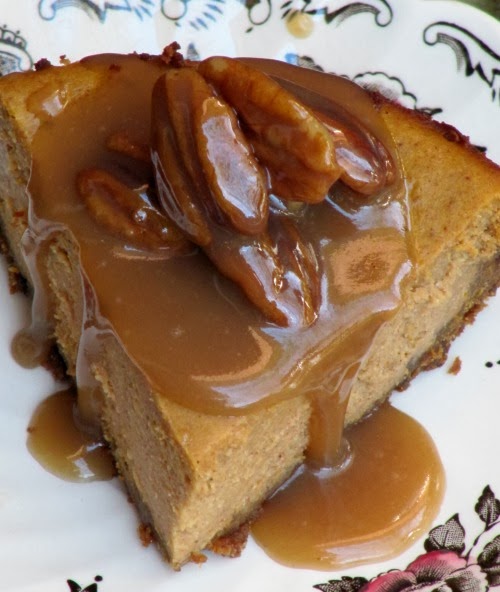 Pumpkin cheesecake with gingersnap crust and pecan praline sauce.