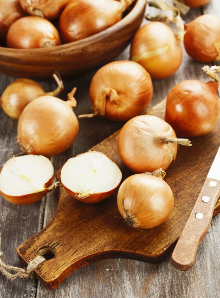 Onions on a chopping board.