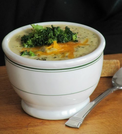 Broccoli and cheddar soup with shredded cheddar on the top.