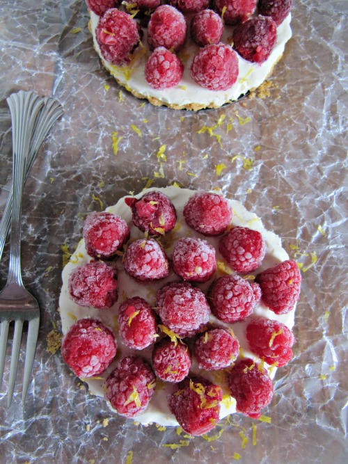raspberry margarita cream tarts in removable bottom tart pans with fresh raspberries