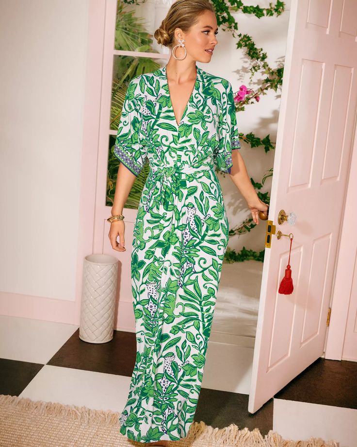 Woman wearing a green and white lily pulitzer dress.