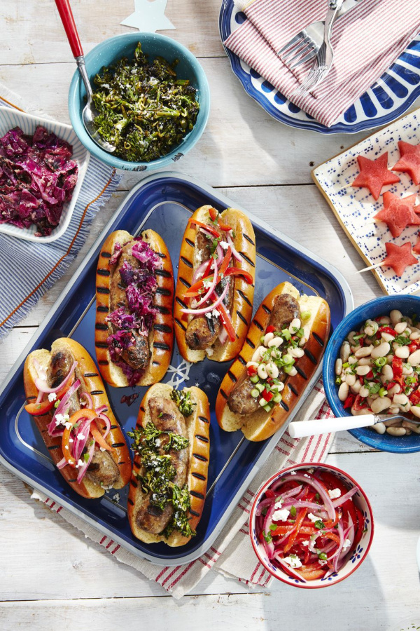 Grilled sausages on buns with all the fixings.