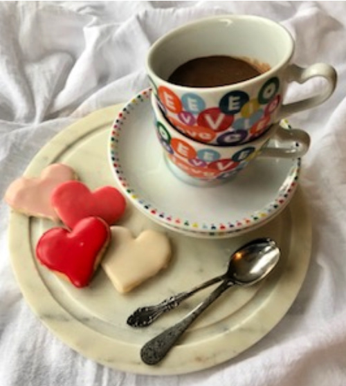 Heart Shaped Valentine Cookies with a cup of hot chocolate