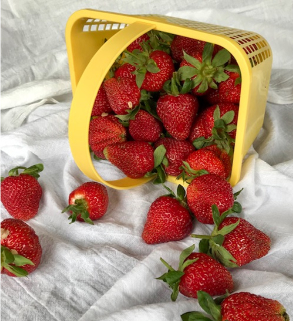 Fresh Strawberries in a yellow basket