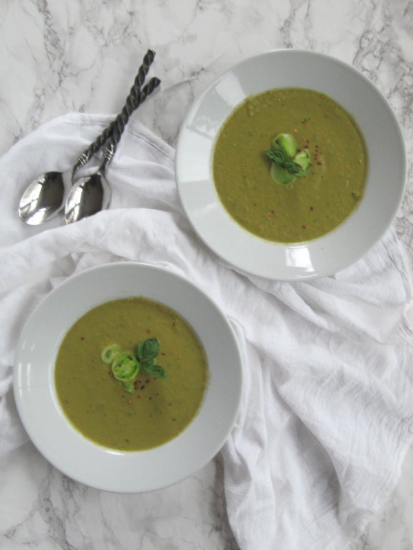 Roasted Green tomato soup in 2 white bowls. 