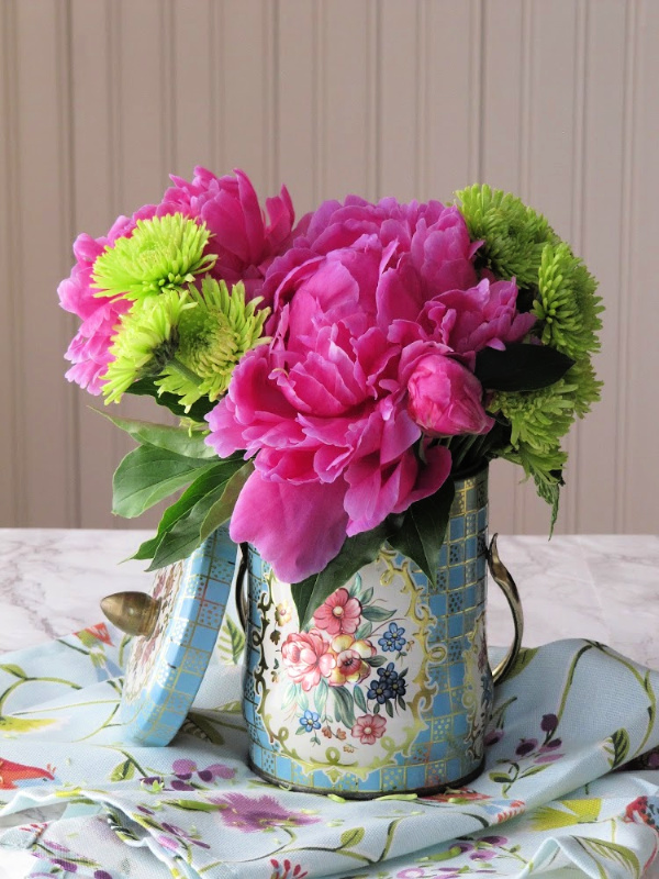 peonies in a vintage tea tin