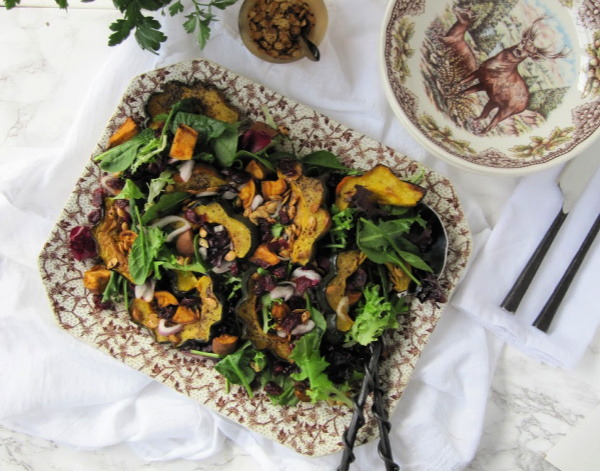 ROASTED ACORNS SQUASH SALAD WITH ROASTED SWEET POTATOES, CRANBERRIES AND SQUASH SEEDS