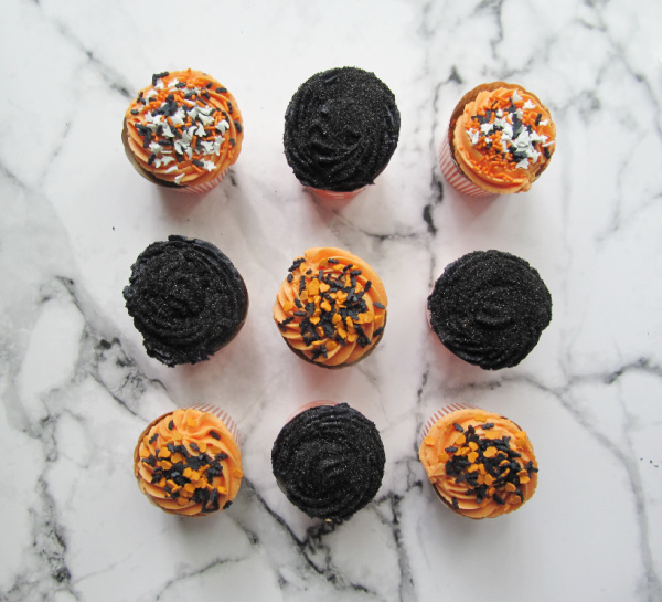 Pumpkin Carrot Cake Cupcakes with Buttercream Icing and Halloween Sprinkles