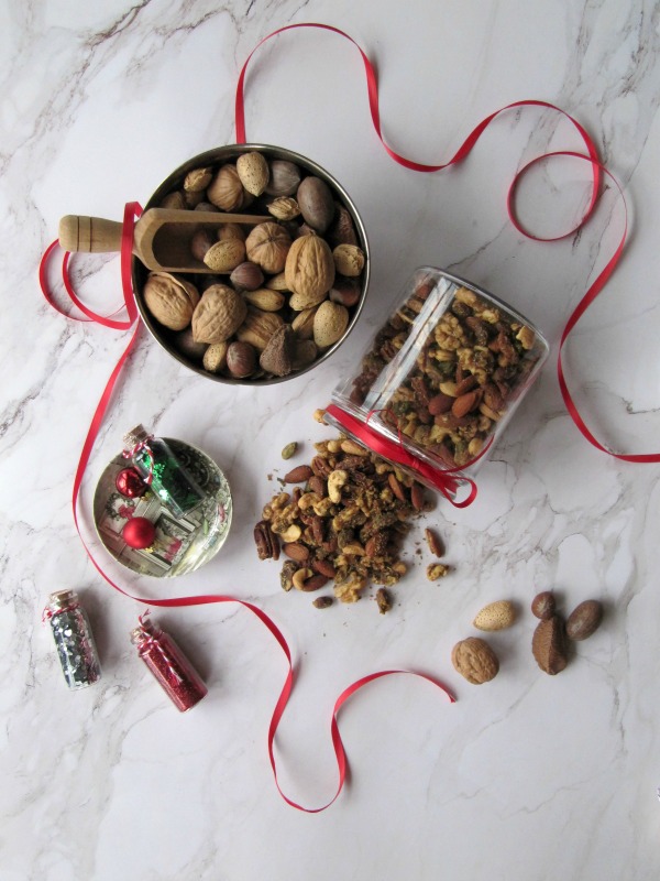Rosemary and Tarragon spicy mixed nuts in a glass jar 