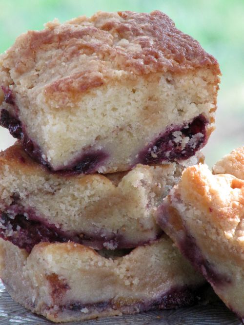 fig blackberry and peach coffeecake three pieces piled on a plate