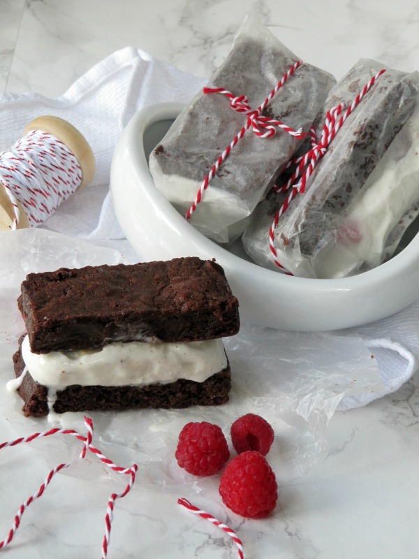chocolate brownie ice cream sandwich with raspberries