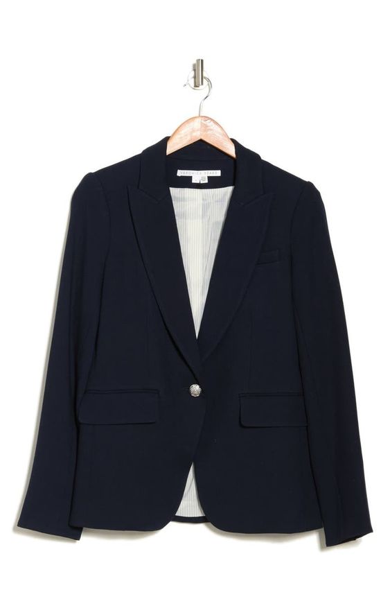 blue blazer with one button on a hanger.