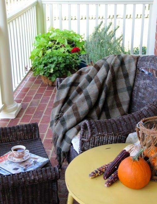 Fall porch with pumpkins and blankets