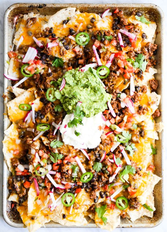 Game day nachos on a large pan.