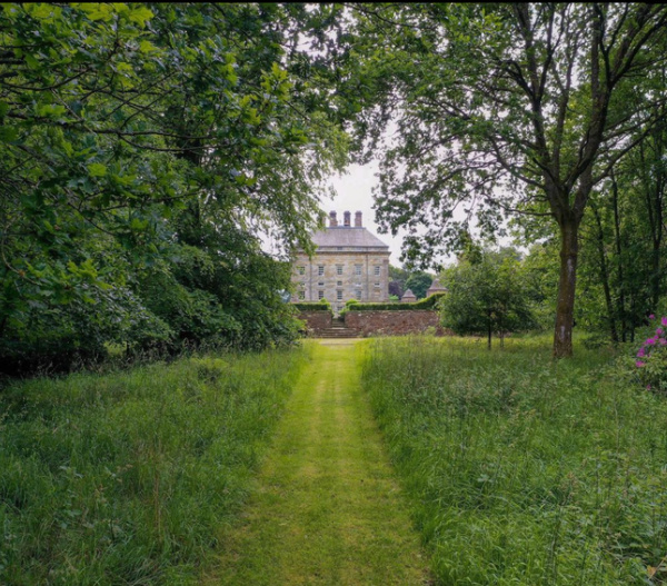 kinross House surrounded by green gardens.