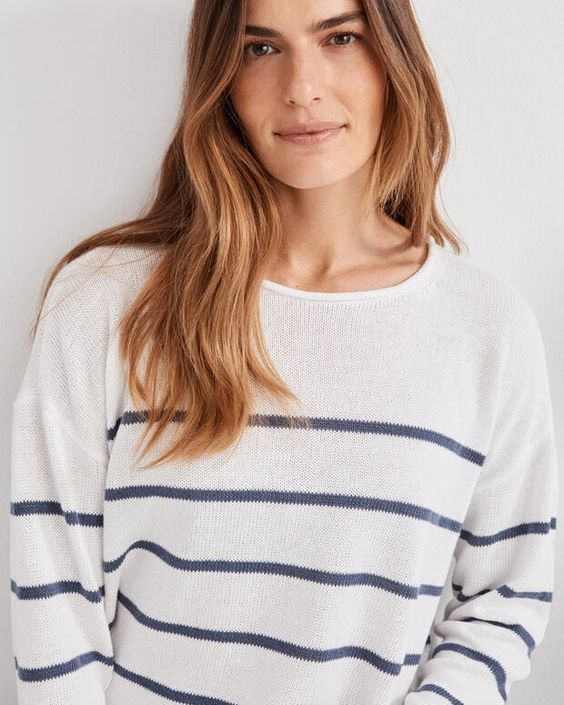 Blue and White roll neck sweater.