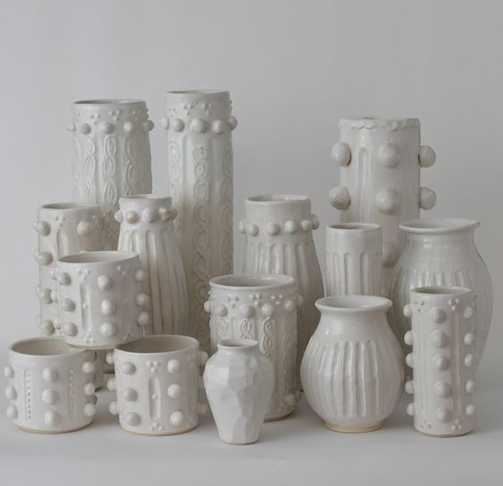 Grouping of handmade white pottery vases. 