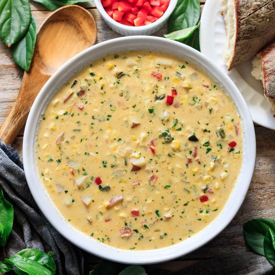 summer corn chowder in a white bowl. 