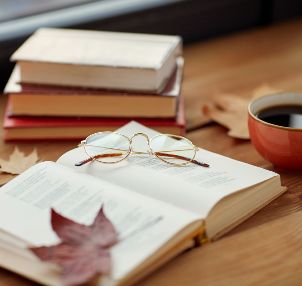 Fall books with leaves and tea.