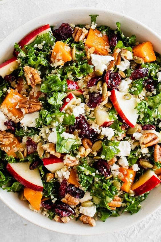 Healthy fall salad with Kale, apples, cranberries.