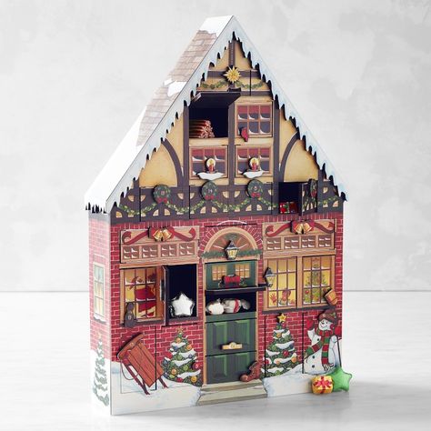 Wood advent calendar shaped like a medieval house. 