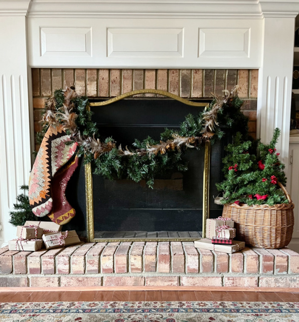 fireplace with stockings and garland