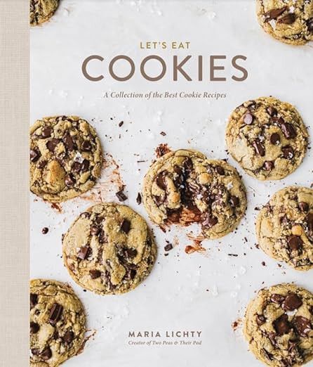 Let's Eat Cookies cookbook with chocolate chip cookies on the cover. 