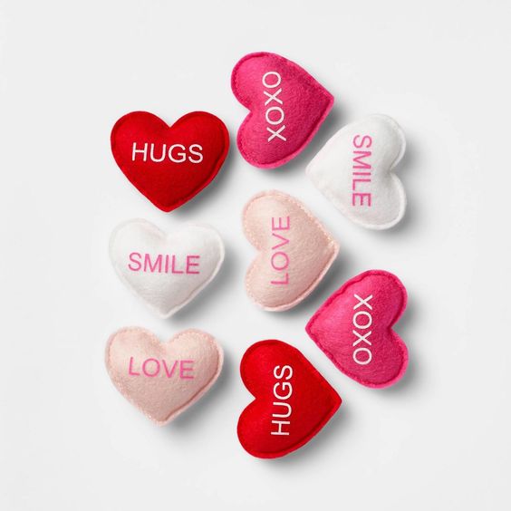 Valentines hearts felt in pink white and red with sayings.