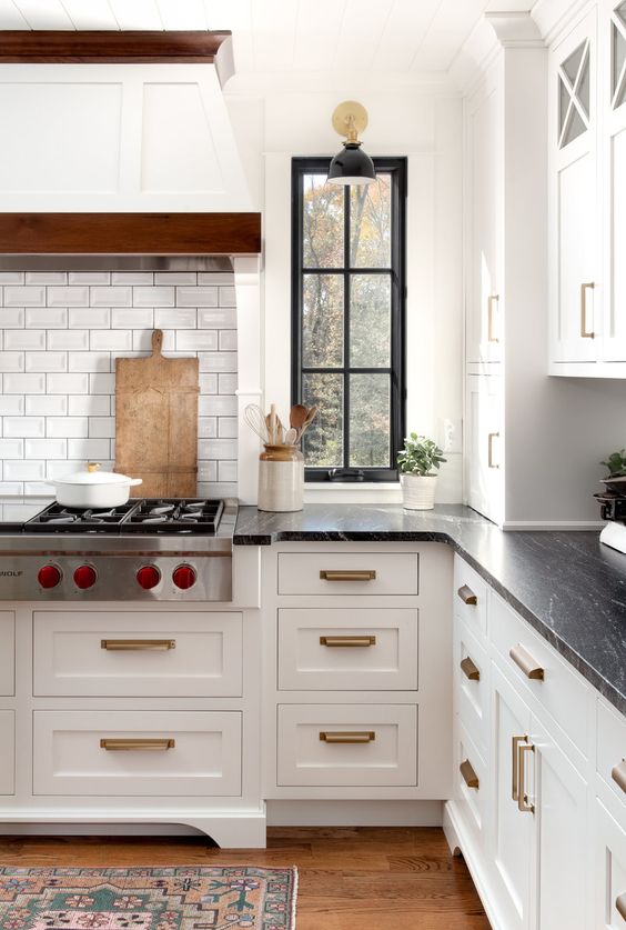 Kate Abt Design white kitchen with black countertops.