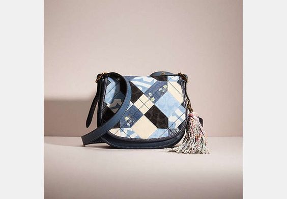 Re-loved patchwork blue coach bag.