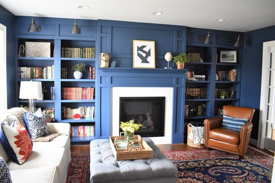 Kate Abt Design, blue library with tan leather chairs.