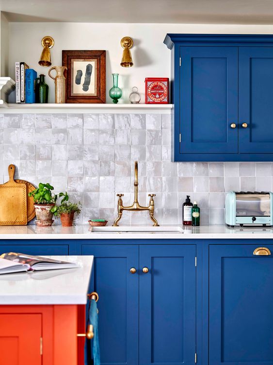 Bright blue and orange kitchen. 