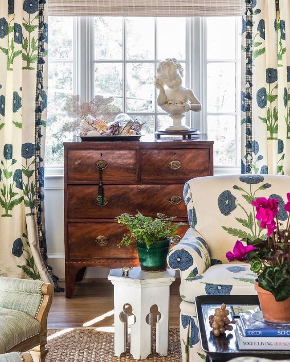 Willard and Palmer Design, Charlotte Lekakos living room with blue and white curtains and vintage furniture.