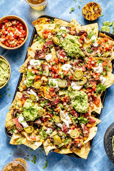 A sheet pan of grilled chipotle nachos.