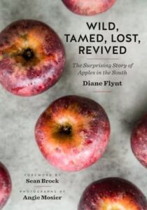 Wild, Tamed, Lost, Revived: The Surprising Story of Apples in the South book cover, gray with red apples on the front. 