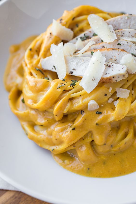 Pumpkin Cream Sauce Fettuccine with a sprinkle of cheese on top. 