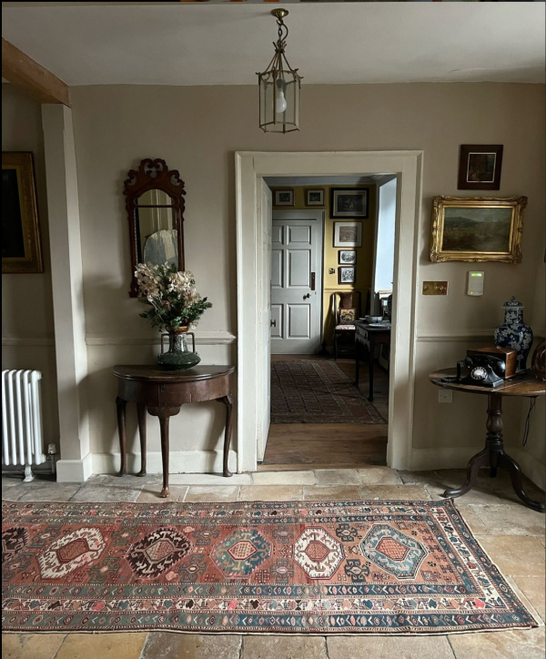 Yarn UK Instagram, an English country house foyer with a Persian rug. 
