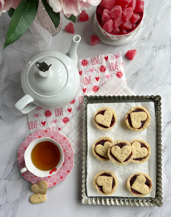 Raspberry Frangipane tarts. with a pot of tea
