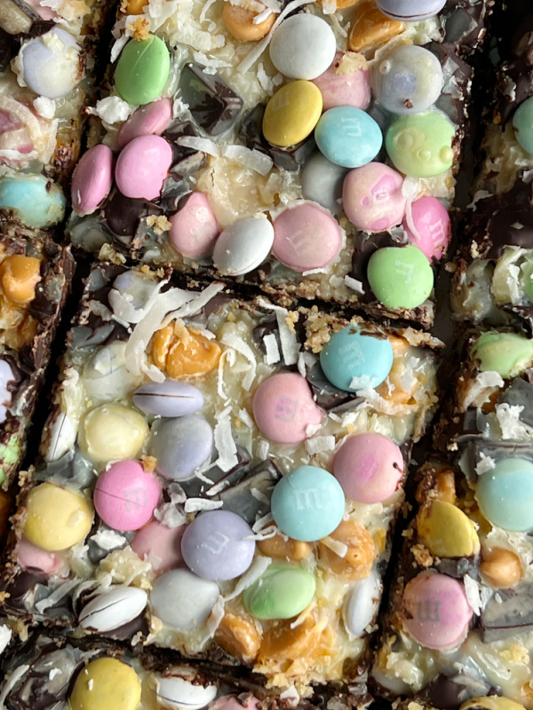 Magic Bars with pastel M&M milk chocolate candies close up.
