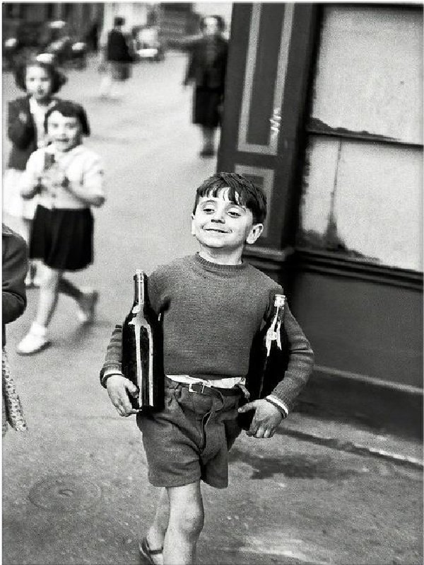 Robert Doiseneau boy with two bottles of wine. 