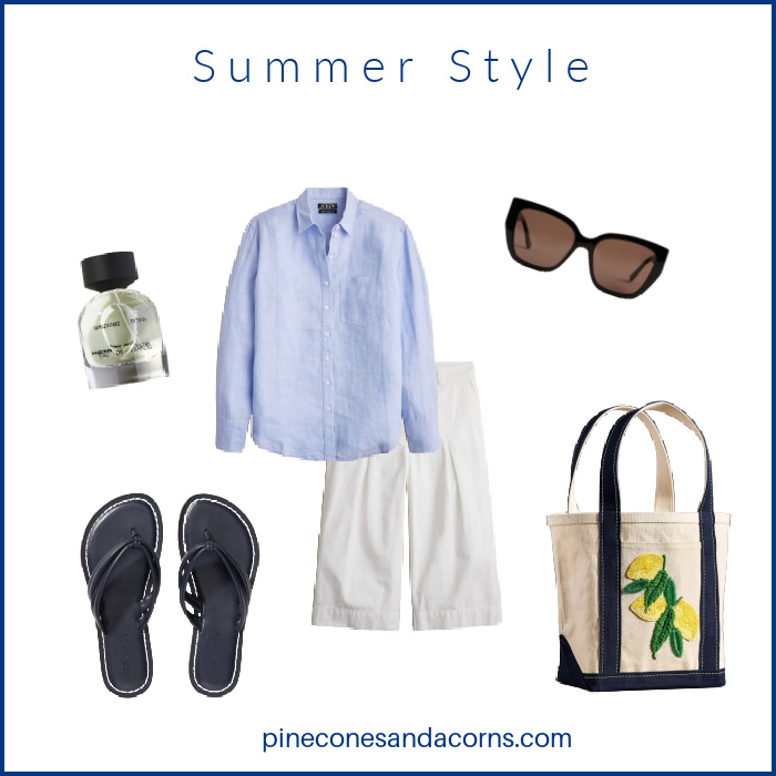 Summer outfit Fashion over 50 Bermuda shorts blue linen shirt, blue sandals, sun glasses, perfumer and a blue and white tote with lemons.