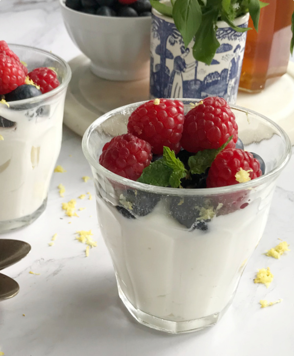 whipped yogurt and berries in a glass.