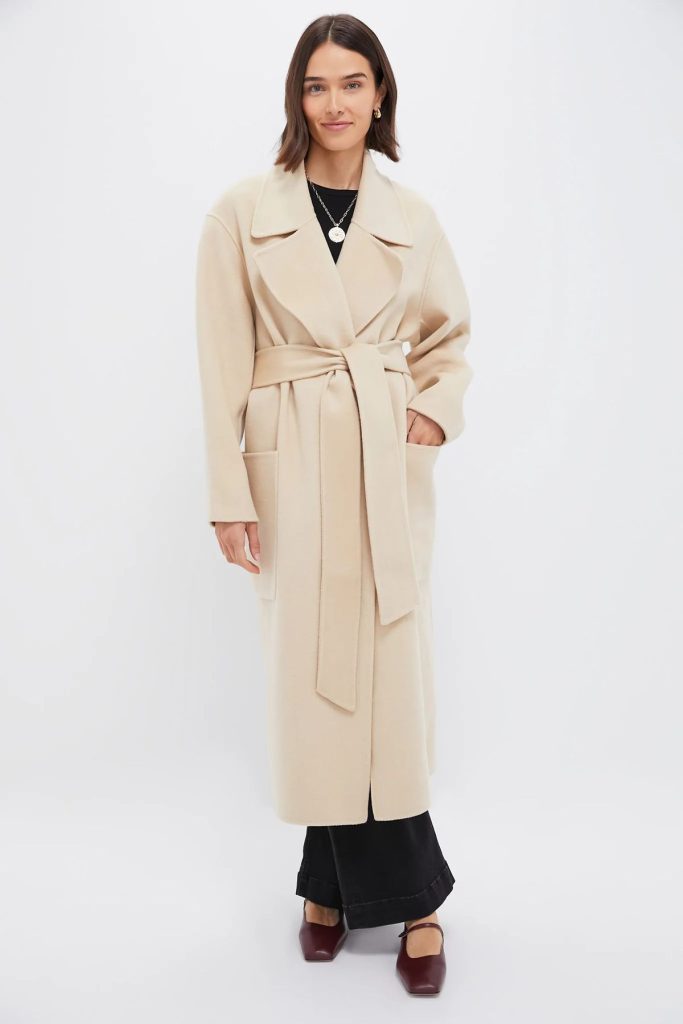 Cream colored wrap trench coat. 