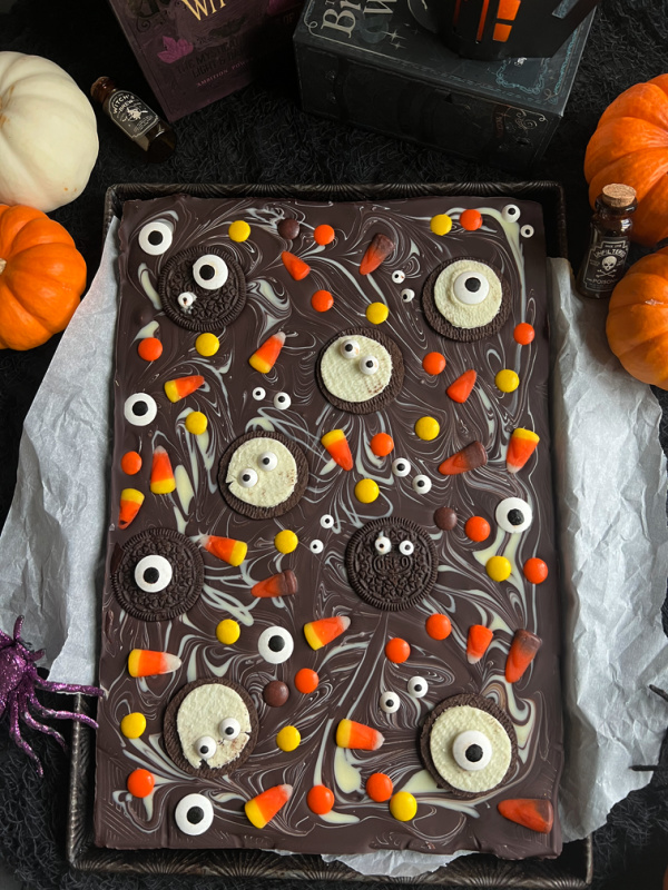 halloween chocolate bark with pumpkins and books.
