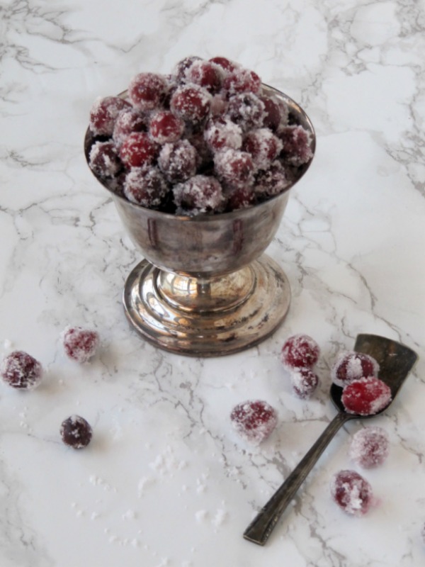 sugared-cranberries in a silver bowl.