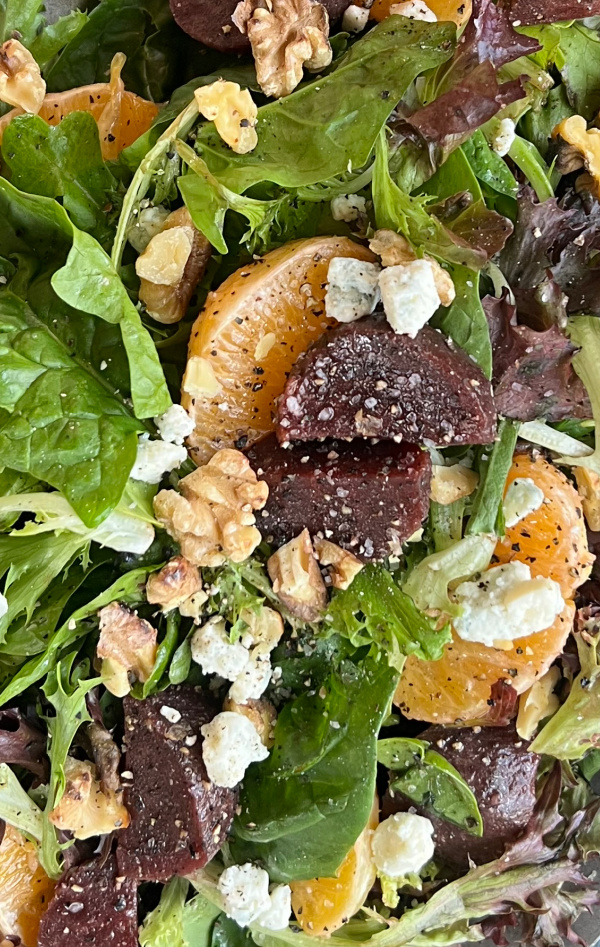 close of beet and oranges and lettuce.