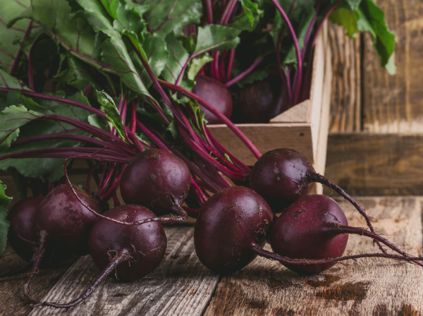 Fresh beets in a wood box.