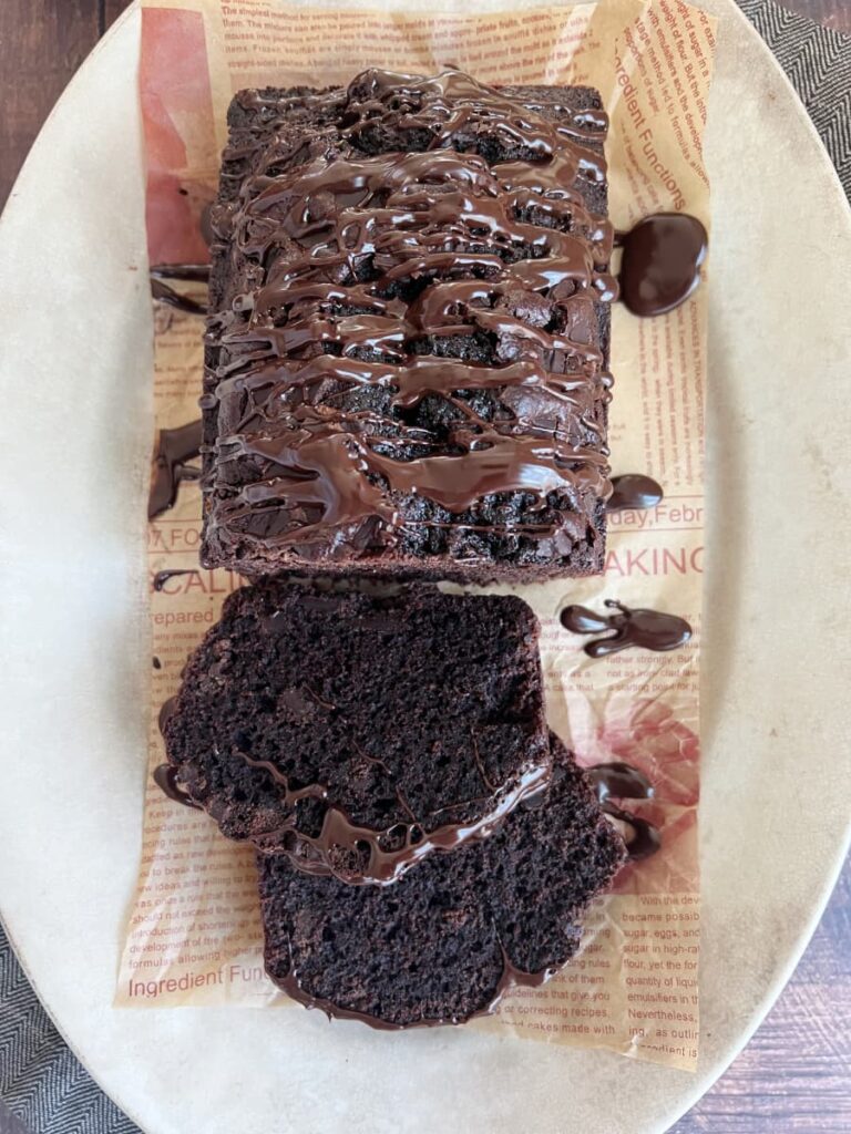 chocolate bread-drizzled with espresso glaze on a piece of newsprint