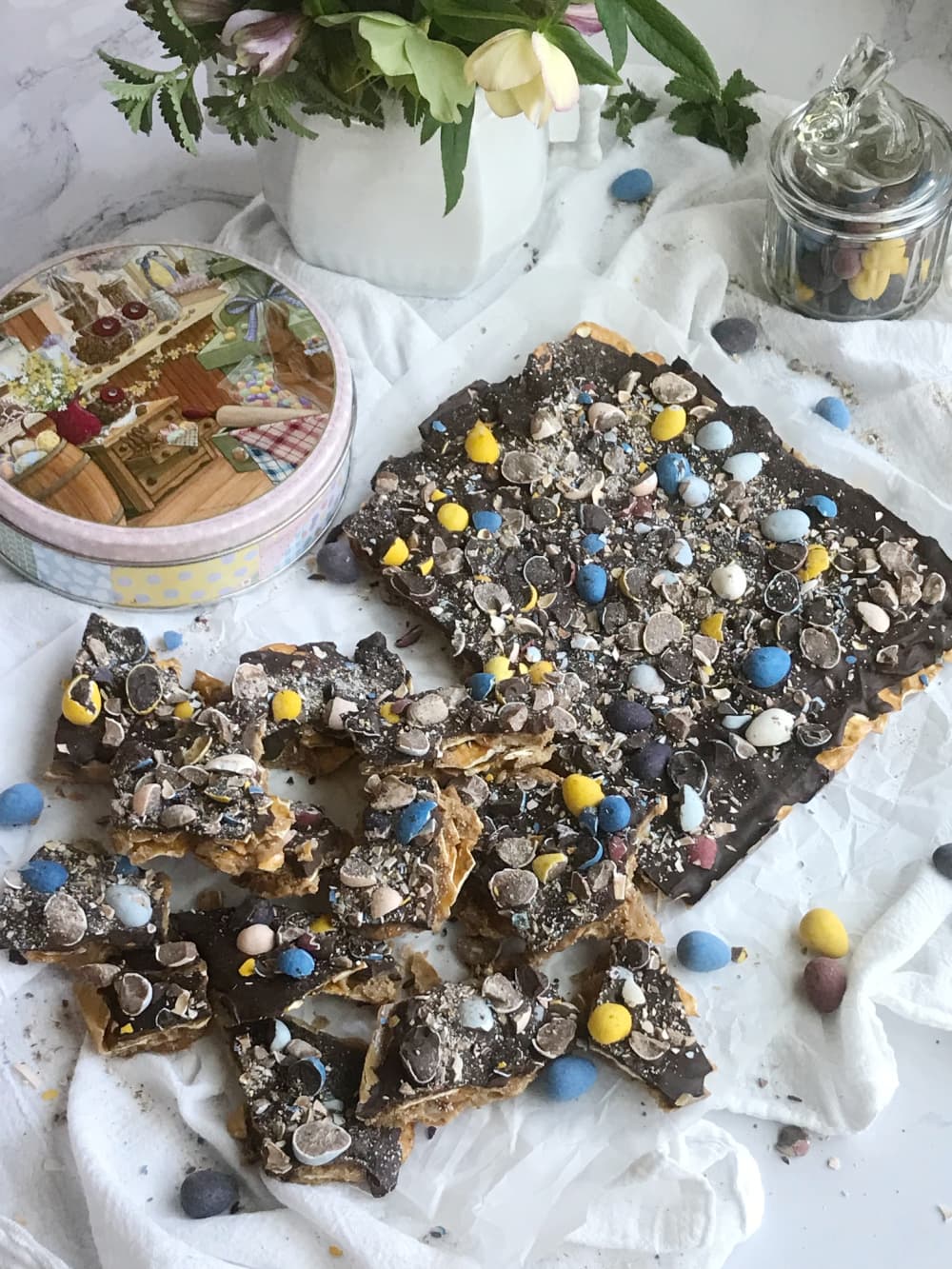 Cadbury mini egg pretzel toffee broken with a bunny jar.