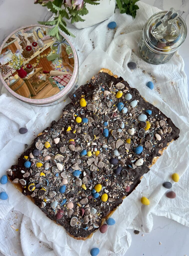 Cadbury mini egg pretzel toffee on parchment paper
